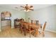 Cozy dining room featuring a wooden table, six chairs, and wood-look flooring at 10530 Maronda Dr, Riverview, FL 33569