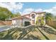 Charming two-story home with a well-maintained lawn, mature trees, and a two car garage at 10530 Maronda Dr, Riverview, FL 33569
