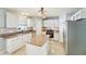 Well-equipped kitchen featuring a center island, stainless steel appliances, and tiled backsplash at 10530 Maronda Dr, Riverview, FL 33569