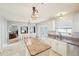 Bright open kitchen with a center island, stainless steel appliances, and access to adjacent rooms at 10530 Maronda Dr, Riverview, FL 33569