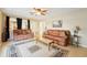 Inviting living room with neutral walls, ceiling fan, plush rug, and arched entryways at 10530 Maronda Dr, Riverview, FL 33569