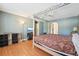 Large main bedroom features wood flooring, a four-poster bed, and plenty of storage space at 10530 Maronda Dr, Riverview, FL 33569