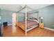 Well-appointed main bedroom featuring wood floors, a decorative bed, and comfortable furnishings at 10530 Maronda Dr, Riverview, FL 33569