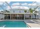 Backyard pool and screened lanai create an ideal private oasis at 10530 Maronda Dr, Riverview, FL 33569