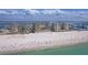 Breathtaking aerial shot showcasing oceanfront condo community with pool and sandy beach access at 11 Baymont St # 1109, Clearwater Beach, FL 33767