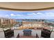 Wide balcony offers seating and stunning views of the bay and the city skyline at 11 Baymont St # 1109, Clearwater Beach, FL 33767
