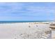 Stunning beach view from this condo with white sand, blue water, and colorful umbrellas dotting the shoreline at 11 Baymont St # 1109, Clearwater Beach, FL 33767