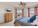 Well-lit bedroom with balcony access, a ceiling fan, and neutral carpeting throughout at 11 Baymont St # 1109, Clearwater Beach, FL 33767