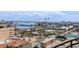 Wonderful city view in this aerial showing commercial buildings, hotels, waterways, and palm trees under a cloudy sky at 11 Baymont St # 1109, Clearwater Beach, FL 33767