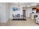 Dining area featuring a modern light fixture and an adjacent open kitchen with bar seating at 11 Baymont St # 1109, Clearwater Beach, FL 33767