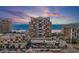 Beautiful exterior shot of this high rise beachfront condo with a view of the beach at sunset at 11 Baymont St # 1109, Clearwater Beach, FL 33767