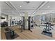Well-equipped fitness center with machine weights, free weights, cardio machines, and plenty of natural light at 11 Baymont St # 1109, Clearwater Beach, FL 33767