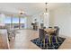 Bright living room with dining area featuring floor-to-ceiling windows and a waterfront view at 11 Baymont St # 1109, Clearwater Beach, FL 33767