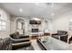 Elegant living room features a marble fireplace, modern lighting, and comfortable seating arrangement at 11 Baymont St # 1109, Clearwater Beach, FL 33767