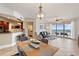 Open floor plan with living, dining, and kitchen areas, tile floors, and beautiful water views at 11 Baymont St # 1109, Clearwater Beach, FL 33767