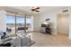 Spacious living room with tile flooring, balcony access, and views of the city and waterfront at 11 Baymont St # 1109, Clearwater Beach, FL 33767