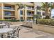 Great outdoor kitchen area with four built-in stainless steel grills and seating for condo residents at 11 Baymont St # 1109, Clearwater Beach, FL 33767
