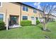 Townhome backyard with well-maintained lawn, patio, and privacy fence, perfect for relaxation at 11521 Crowned Sparrow Ln, Tampa, FL 33626