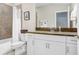 Well-lit bathroom featuring a single vanity, framed mirror, granite countertops, and shower/tub combo at 11521 Crowned Sparrow Ln, Tampa, FL 33626