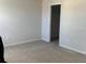 Carpeted bedroom features a closet and bright, neutral walls at 11624 Fringetree Ct, Riverview, FL 33579