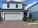 Charming two-story home featuring a two-car garage and brick paved driveway at 11624 Fringetree Ct, Riverview, FL 33579