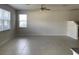 Open-concept living room with tile flooring and plenty of natural light at 11624 Fringetree Ct, Riverview, FL 33579