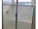 Tiled shower featuring a glass enclosure and built-in bench at 11624 Fringetree Ct, Riverview, FL 33579