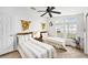 Bedroom with two twin beds, a nightstand, ceiling fan and natural light at 12501 Ulmerton Rd # 133, Largo, FL 33774