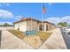 Inviting community center with an American flag, exterior seating, and ample parking at 12501 Ulmerton Rd # 133, Largo, FL 33774
