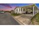 Charming single-Gathering home with black shutters and a covered carport offering both style and convenience at 12501 Ulmerton Rd # 133, Largo, FL 33774