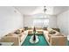 Spacious living room with modern decor, vaulted ceiling, and large windows for natural light at 12501 Ulmerton Rd # 133, Largo, FL 33774