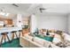 Bright open living area featuring a ceiling fan, modern furnishings, and wood flooring at 12501 Ulmerton Rd # 133, Largo, FL 33774