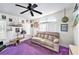 Cozy living room with custom decor, unique furnishings, and natural light from large windows at 12501 Ulmerton Rd # 133, Largo, FL 33774