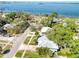 Spectacular aerial view of the property highlighting its prime location near the water and picturesque surroundings at 126 Orangewood Dr, Dunedin, FL 34698