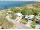 Property aerial shows the house, its yard, and prime location near the water at 126 Orangewood Dr, Dunedin, FL 34698
