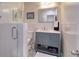 Bathroom with glass shower, tile, a vanity with a large framed mirror, and decor at 126 Orangewood Dr, Dunedin, FL 34698