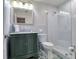 Clean bathroom featuring a glass-enclosed shower and a stylish vanity with a marble countertop at 126 Orangewood Dr, Dunedin, FL 34698