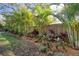 Lush landscaping with a variety of trees and shrubs, perfect for creating a private and peaceful backyard oasis at 126 Orangewood Dr, Dunedin, FL 34698