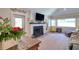 Cozy living room showcasing a fireplace, large windows, and natural light at 126 Orangewood Dr, Dunedin, FL 34698