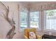 Bright sitting area with a corner window, comfortable seating, and bird statuary at 126 Orangewood Dr, Dunedin, FL 34698
