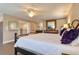 Close-up of the main bedroom featuring a decorative bed frame and hardwood flooring throughout at 126 Orangewood Dr, Dunedin, FL 34698