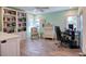 Home office with bright sunlight, built in shelving, and desk area at 126 Orangewood Dr, Dunedin, FL 34698