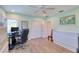 Bright home office features natural light, work space, and modern décor at 126 Orangewood Dr, Dunedin, FL 34698
