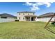 The home has a large backyard with a covered patio, perfect for outdoor living at 13113 Rain Lily Dr, Riverview, FL 33579