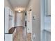 Hallway with tile flooring, a storage bench and coat hooks by the front door at 13113 Rain Lily Dr, Riverview, FL 33579