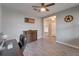 Versatile home office with a wooden cabinet and convenient access to the home's entryway at 13113 Rain Lily Dr, Riverview, FL 33579