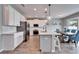 Kitchen featuring a center island with seating and a dining area at 13113 Rain Lily Dr, Riverview, FL 33579