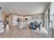 Open-concept living space with kitchen, dining area, and staircase for easy entertaining at 13113 Rain Lily Dr, Riverview, FL 33579