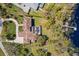 Gorgeous aerial view showcasing a large house, pristine landscaping, pool, and waterfront access, all in one shot at 16119 Carencia Ln, Odessa, FL 33556