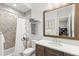Charming bathroom with chevron tile, spacious vanity, and a shower-tub combo, perfect for a  at 16119 Carencia Ln, Odessa, FL 33556